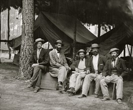 Petersburg, Va. Military telegraph operators at headquarters; another group 1864