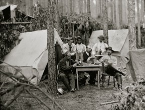 Petersburg, Va. Officers of the 114th Pennsylvania Infantry playing cards in front of tents 1864