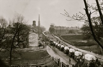 Petersburg, Va. The first Federal wagon train entering the town 1865