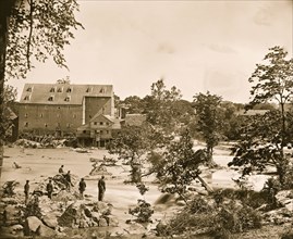 Petersburg, Va., vicinity. Johnson's Mill on the Appomattox near Campbell's Bridge; soldiers standing on rocks in the stream 1865