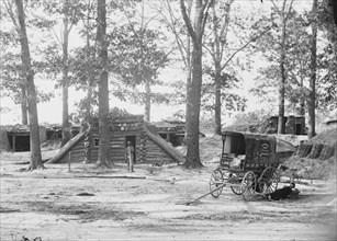 Petersburg, Virginia. Bomb-proofs in front of Petersburg. (Photographic wagon, Engineer Department shown 1865