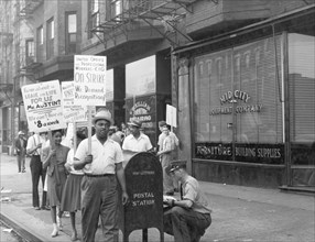 Picket line in front of Mid-City Realty Company. South Chicago, Illinois 1941
