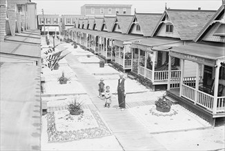 Porches and front lawns of row of bungalows, Rockaway, N.Y.