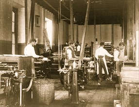Pressmen at work in printing shop, Hampton Institute 1899