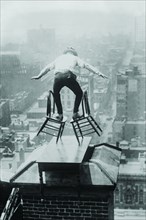 Reynolds performs a balancing act on roof in New York City