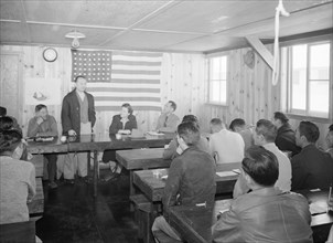 Roy Takano [i.e., Takeno] at town hall meeting, Manzanar Relocation Center, California 1943