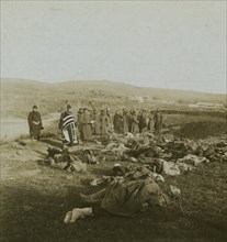 Russians praying over dead comrades brought back from the front 1905