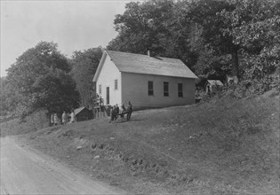 Schools are snuggled up into hillside as this one is - and the road usually runs very near the building. Sunset School, Pocahontas Co. W. Va. Frequently there is little or no level place for a playgro...