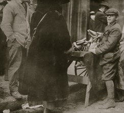 Selling bananas at market.  1917