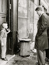 Senator Robert] Kennedy discusses school with young Ricky Taggart of 733 Gates Ave.  1966