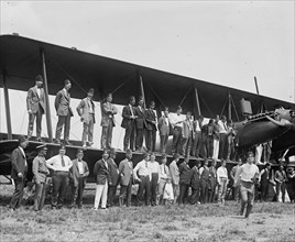 Shriners pose on wings of Biplane at Bolling Field 1923