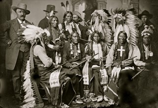 Sioux and Arapahoe Indian Delegations. L to R Seated - Red Cloud, Big Road, Yellow Bear, Young Man Afraid of his Horses, Iron Crow. L to R Standing - Little Bigman, Little Wound, Three Bears, He Dog 1...