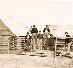 Soldier chopping wood in camp 1863