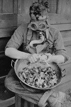 Soldier dons Gas Mask to Protect himself from Crying over Onions