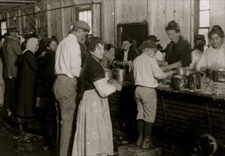 Young shrimp-pickers at Dunbar, Lopez, Dukate Co., Sore, swollen, and even bleeding fingers are common among these workers on account of the acid in the shrimp. 1911