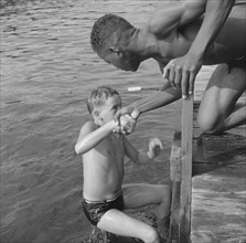 Interracial activities at Camp Nathan Hale- A scene at the swimming dock 1943