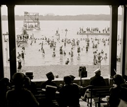 Spectators in a Shore Pavillion overlook the swimmers and divers in the Washington Tidal Basin 1923