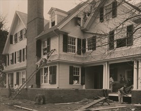 Students at work on a house built largely by them 1899