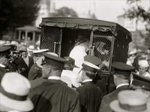 Suffragettes arrested and put in paddy wagon 1913