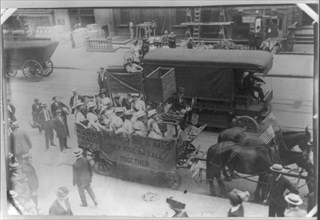 Suffragettes in horse-drawn wagon on way to City Hall\ Yonkers, NY 1913