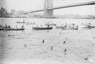 Swimmers Race to Coney Island just past the Brooklyn Bridge