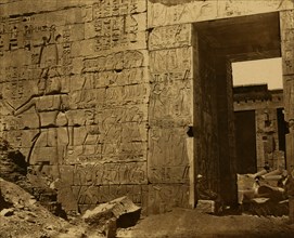 Temple wall with hieroglyphics and entrance, rubble inside and out, Medinet Habu Site, Egypt 1880