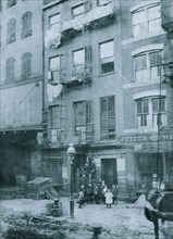 Tenement house with children in front. Possibly 36 Laight St. 1910