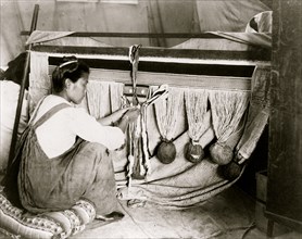 hilkat woman weaving blanket, Alaska 1910