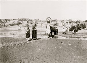 The Shalaco dancers crossing to south side of the river to dance on the plain 1898