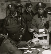 Black fighter pilot series: "Escape kits" (cyanide) being distributed to fighter pilots at air base in southern Italy, 1945 1945