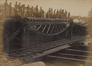 Third series of experiments with board trusses-construction corps loading the bridge for the purpose of testing it 1863