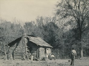 Three African Americans outside a cabin, possibly Mt. Meigs, Alabama 1890