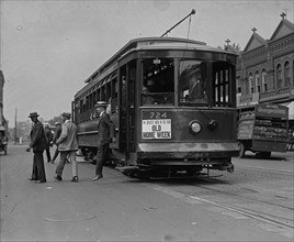 Three men alight from a DC Trolley 1925