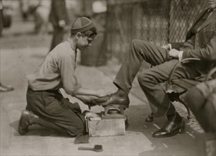 Tony, a twelve year old bootblack at his station in Bowling Green, New York City.  1924