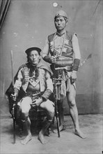 Two Formosan Tribal Chiefs in Native Garb pose