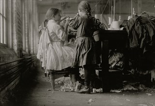 Two of the tiny workers, a raveler and a looper in Loudon Hosiery Mills. 1910