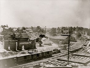View of Atlanta, Georgia, with railroad cars in left foreground 1863