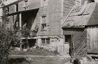 W.A. Copen's old home at Big Chimney, W. Va. Windows out on upper floor and generally run down 1921