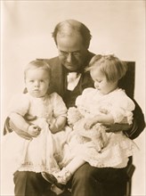 W.J. Bryan holding two grandchildren on his lap nown