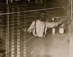Warper at his machine, Newton, N.C. 1908