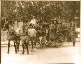 Horse Drawn Fire engine pumper with department poses for the camera in uniform 1911