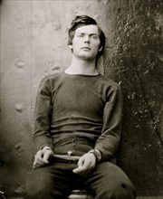 Washington Navy Yard, D.C. Lewis Payne, in sweater, seated and manacled 1865