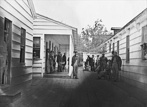 Washington, D.C. Convalescent soldiers and others outside quarters of the Sanitary Commission Home Lodge 1865