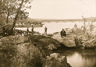 Georgetown ferry-boat carrying wagons, and Aqueduct Bridge beyond, from rocks on Mason's Island 1863