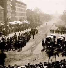 Washington, D.C. Group of ambulances followed by band and infantry units on Pennsylvania Avenue near the Treasury 1865