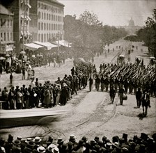 Washington, D.C. Infantry unit with fixed bayonets followed by ambulances passing on Pennsylvania Avenue near the Treasury 1865
