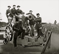 Washington, District of Columbia. Officers and men, 3d Regiment Massachusetts Heavy Artillery by Columbiad guns, Fort Totten 1865