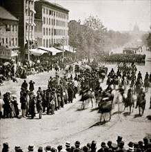 Washington, District of Columbia. The Grand Review of the Army. Gen. Henry W. Slocum (Army of Georgia) and staff passing on Pennsylvania Avenue near the Treasury 1865