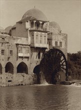 Water Wheel Ouside of Mosque turns by its passing River 1920