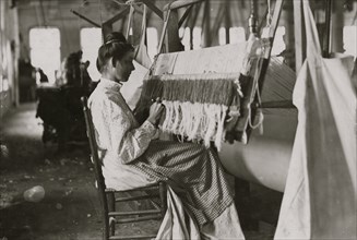 Woman at beam warper.  1908